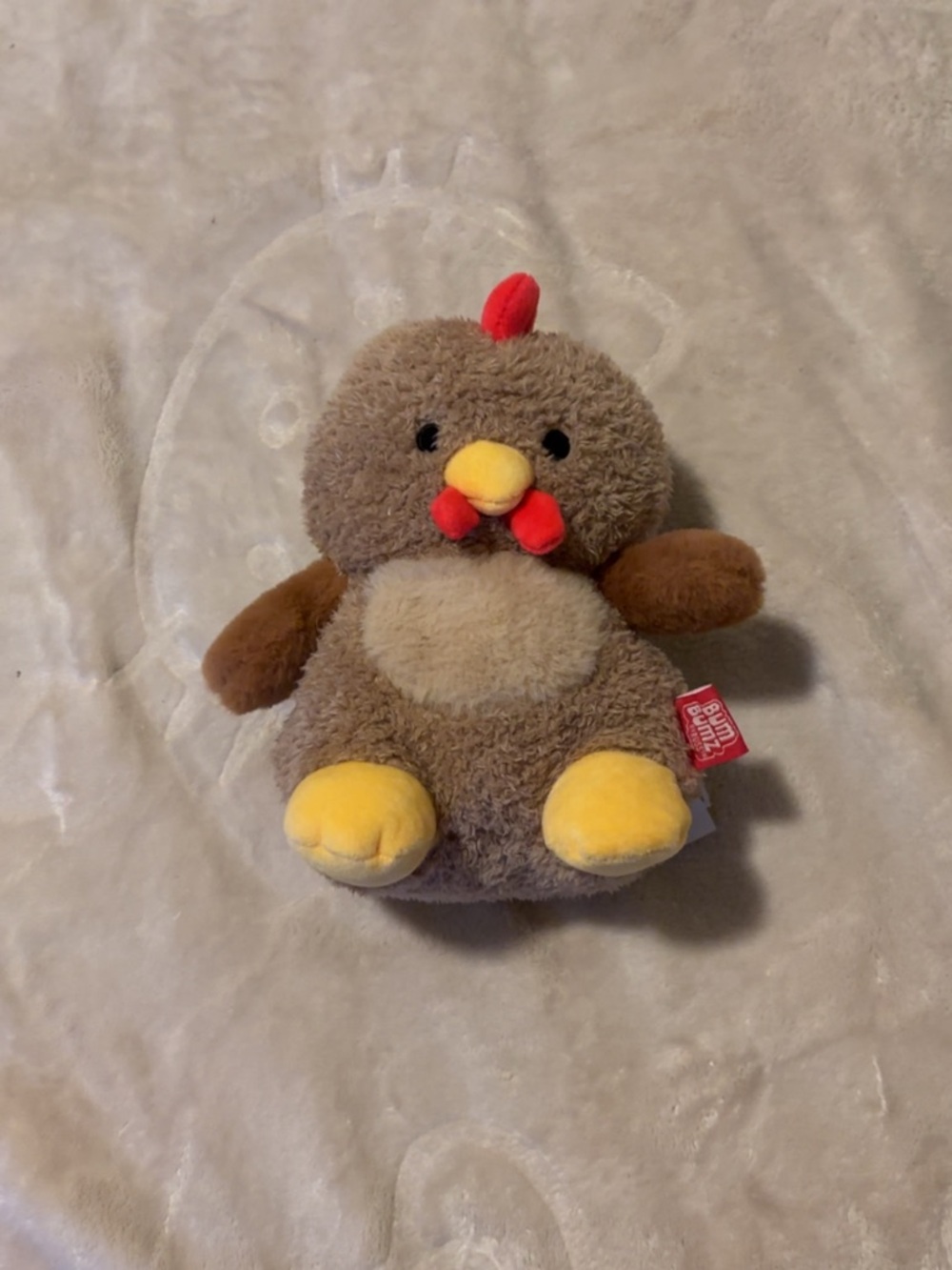 Small, brown chicken bum bums plush/stuffed animal